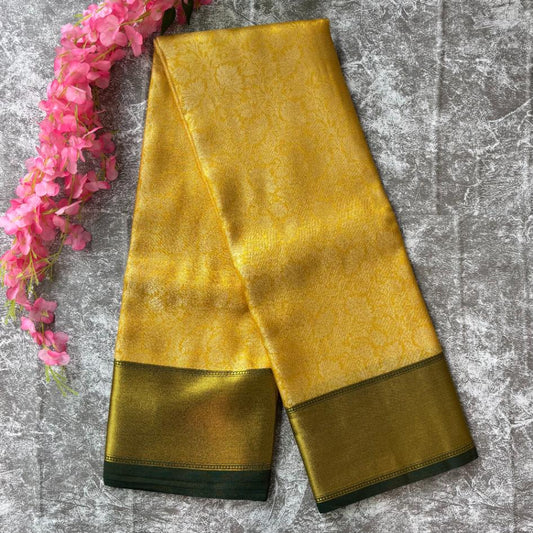 Yellow gold and bottle green tissue silk saree