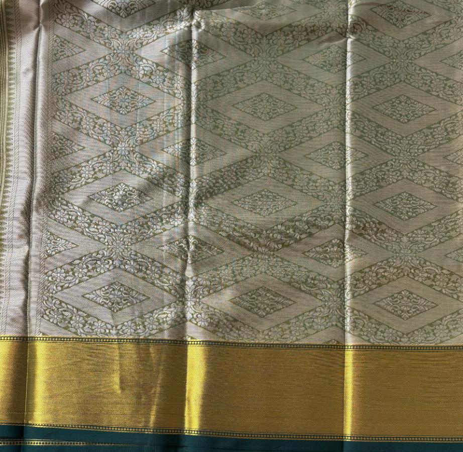 Yellow gold and bottle green tissue silk saree